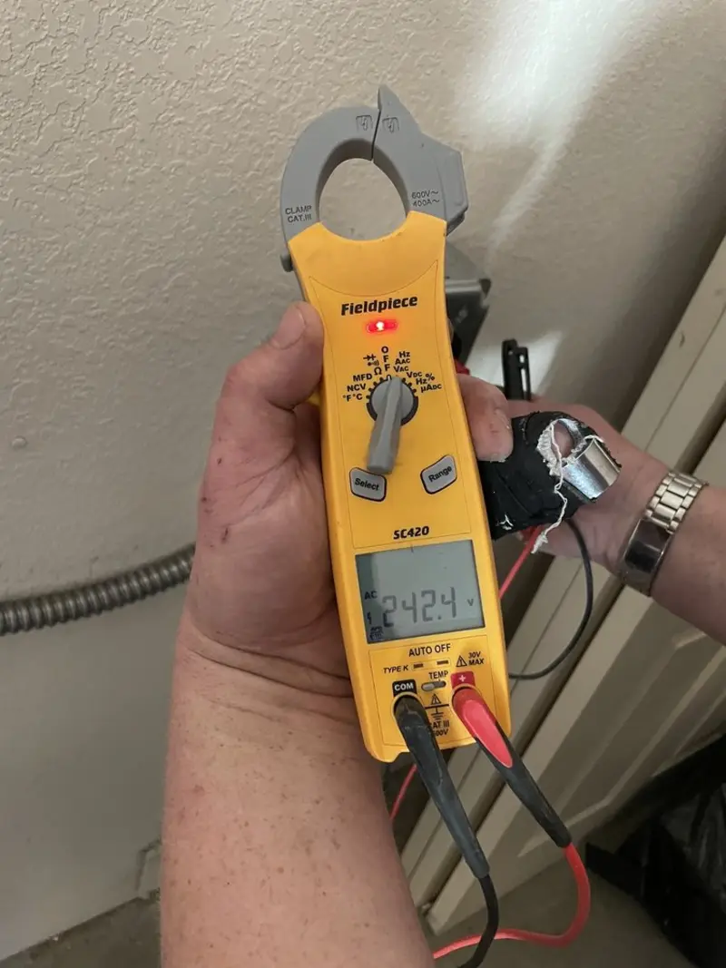 Voltage testing with clamp meter during Electrical Installation Services in Cherry Hills Village